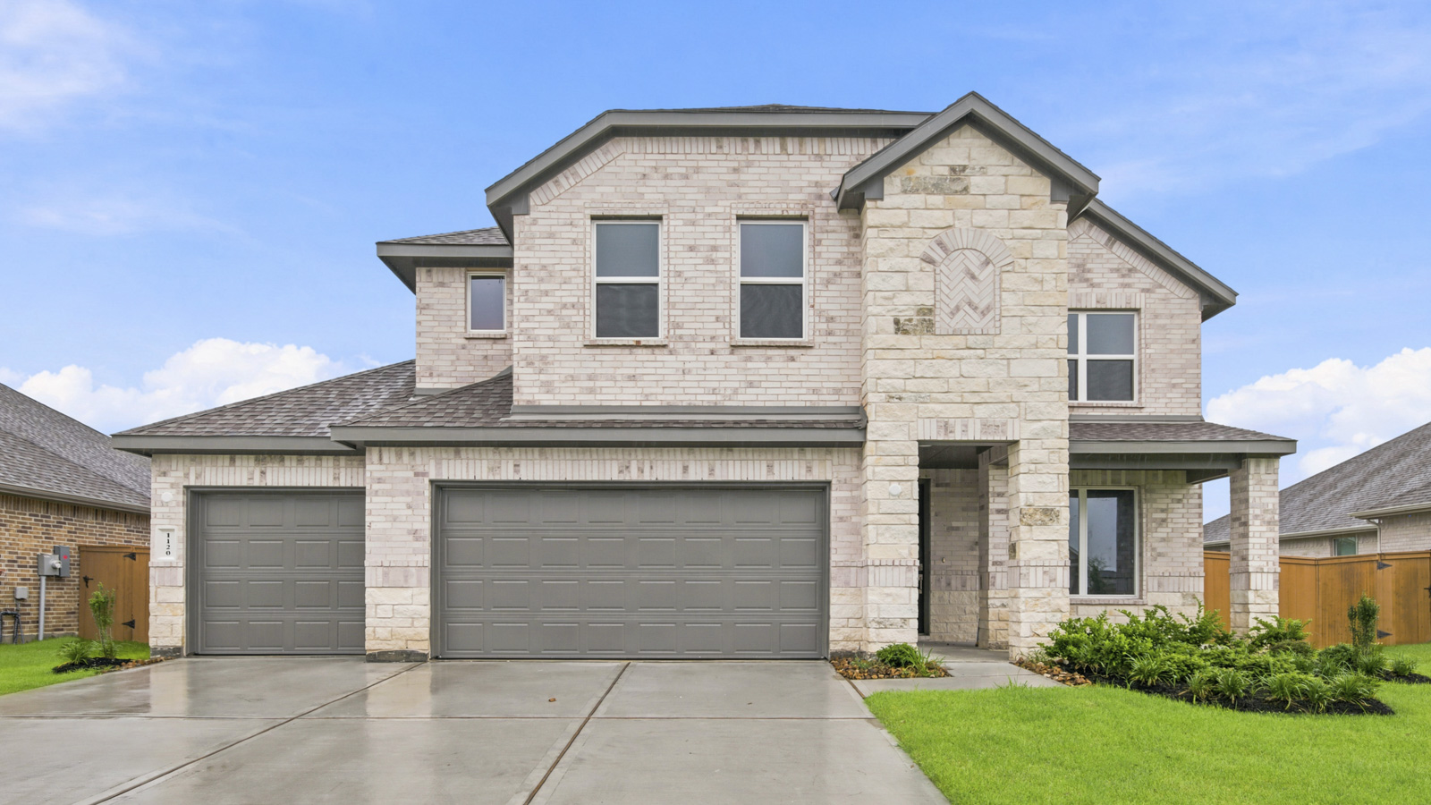 Two story home with three car garage