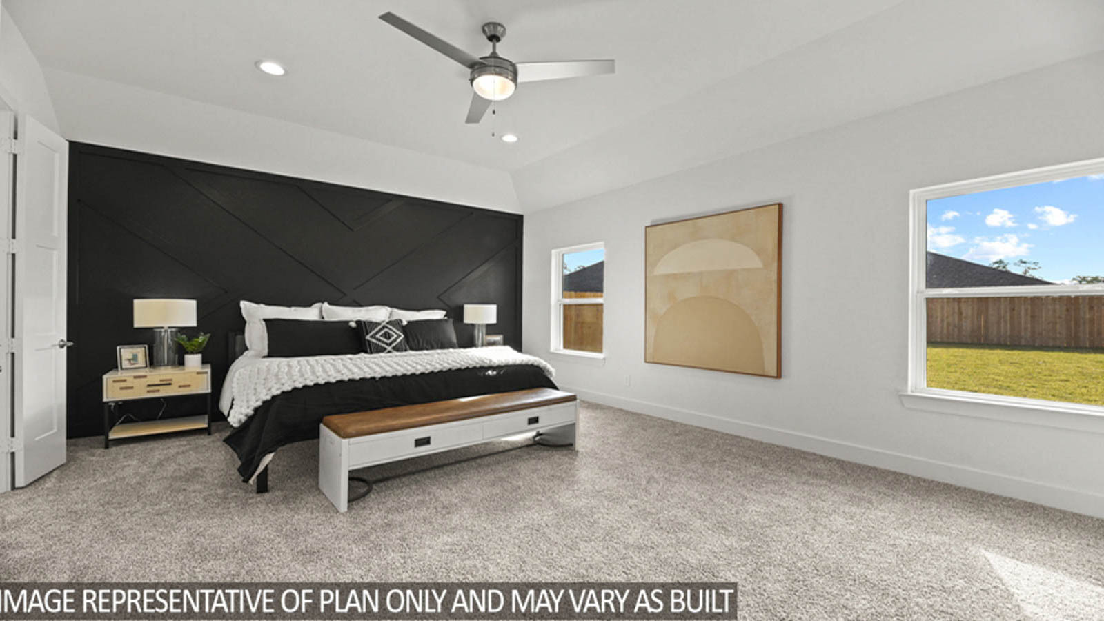 Primary bedroom with carpet flooring