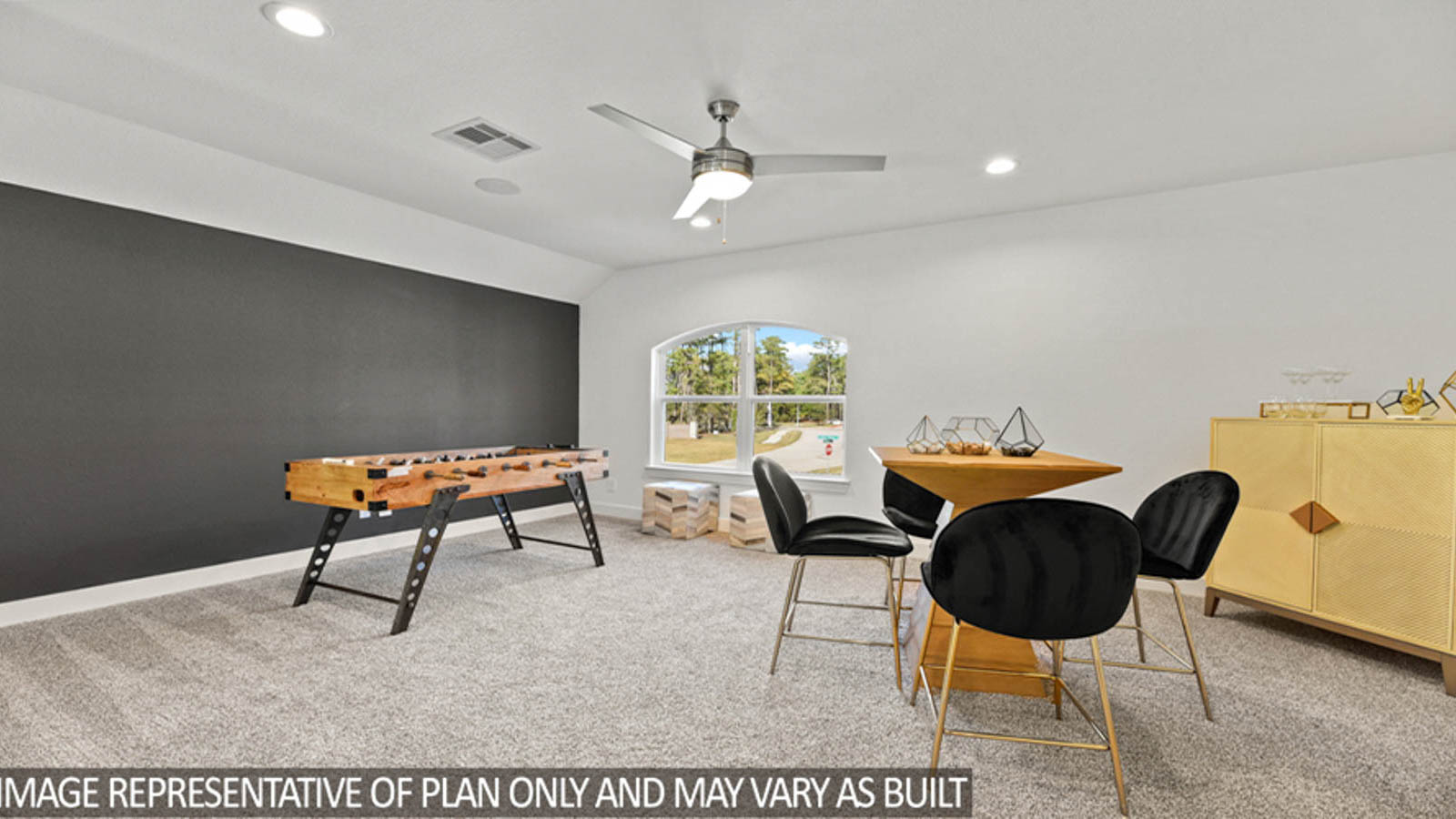 Second story game room with carpet flooring