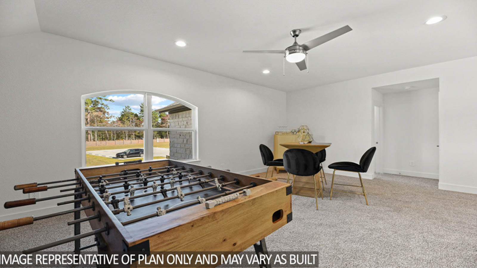 Second story game room with carpet flooring