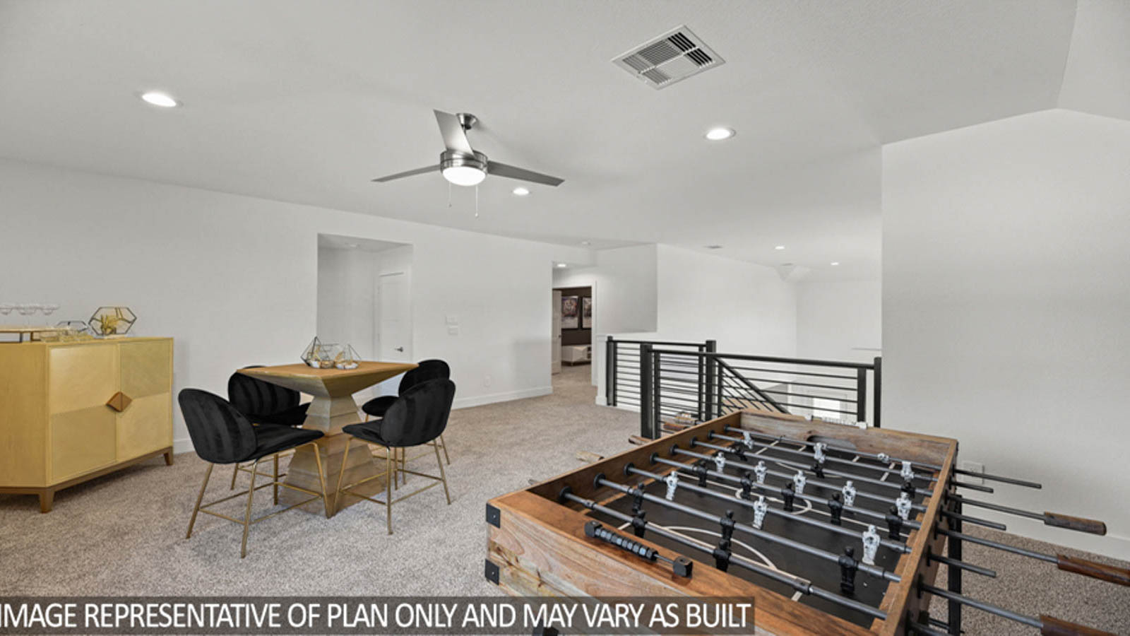 Second story game room with carpet flooring