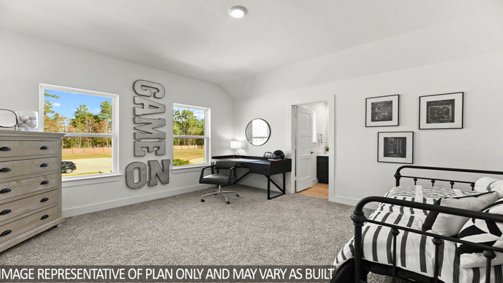 Secondary bedroom with carpet flooring