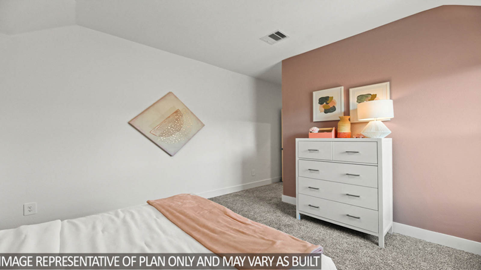 Secondary bedroom with carpet flooring