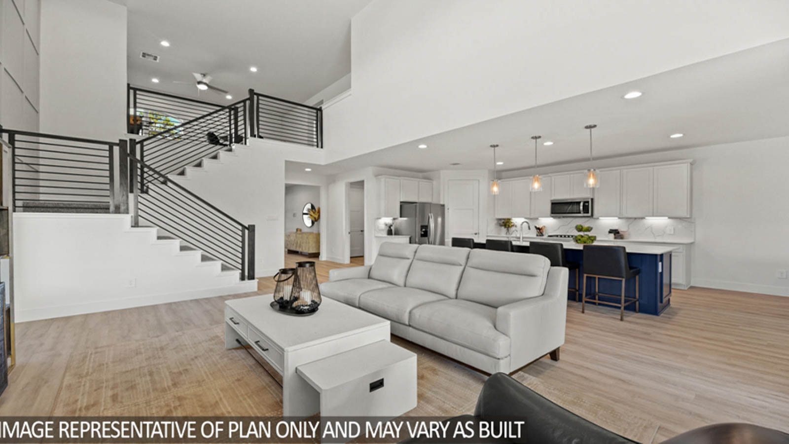 Open concept living and dining area with vinyl flooring and bright windows.