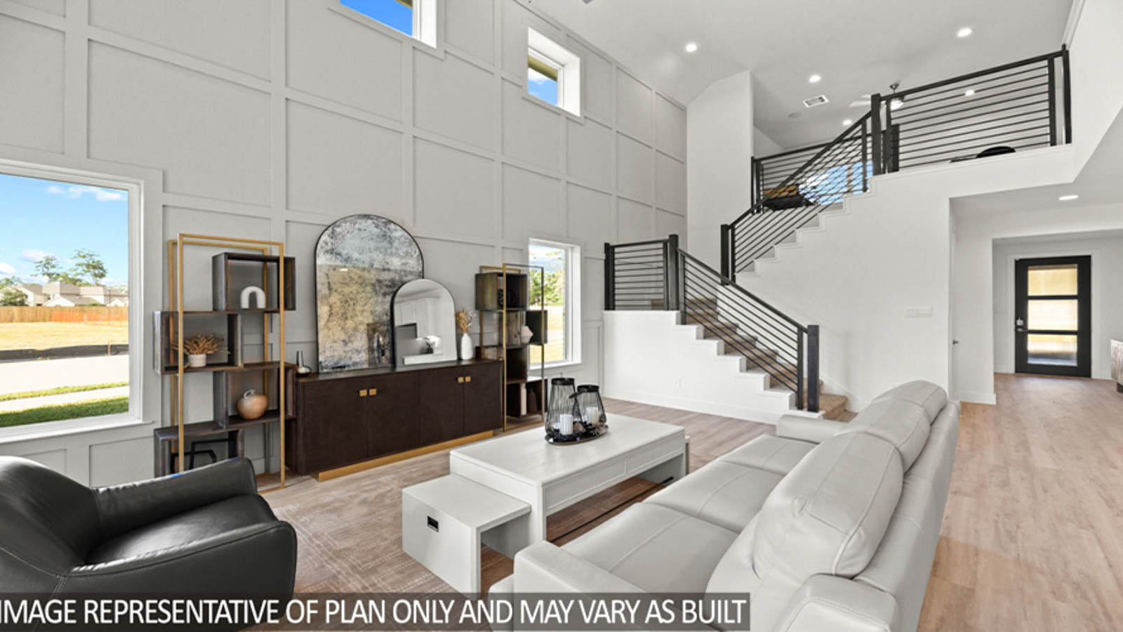 Open concept living and dining area with vinyl flooring and bright windows.