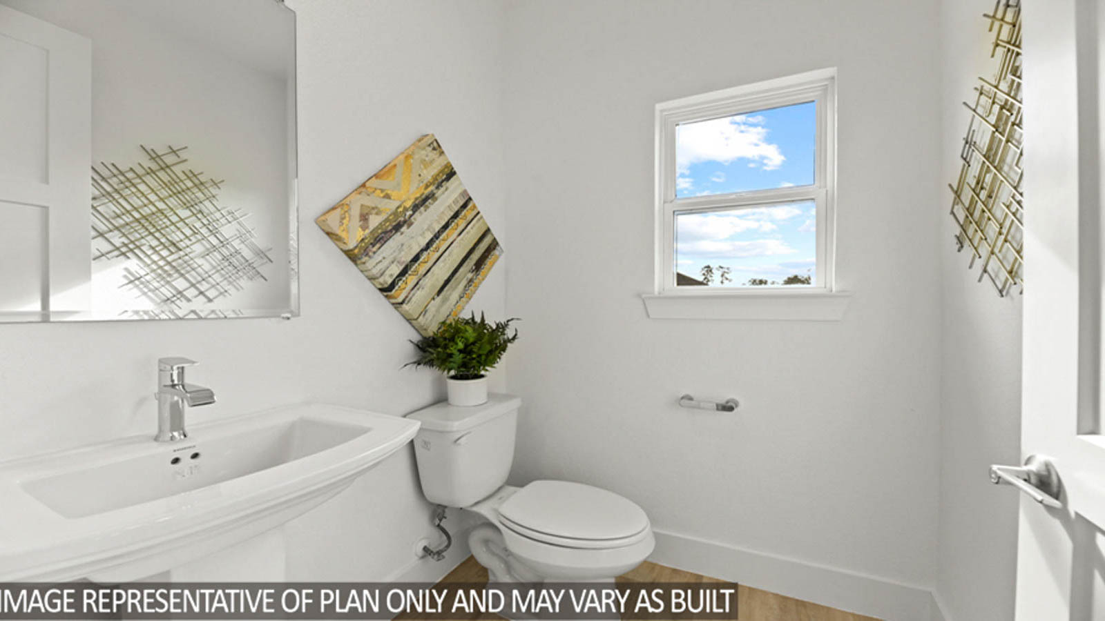 Powder room with a small window and a pedestal sink.