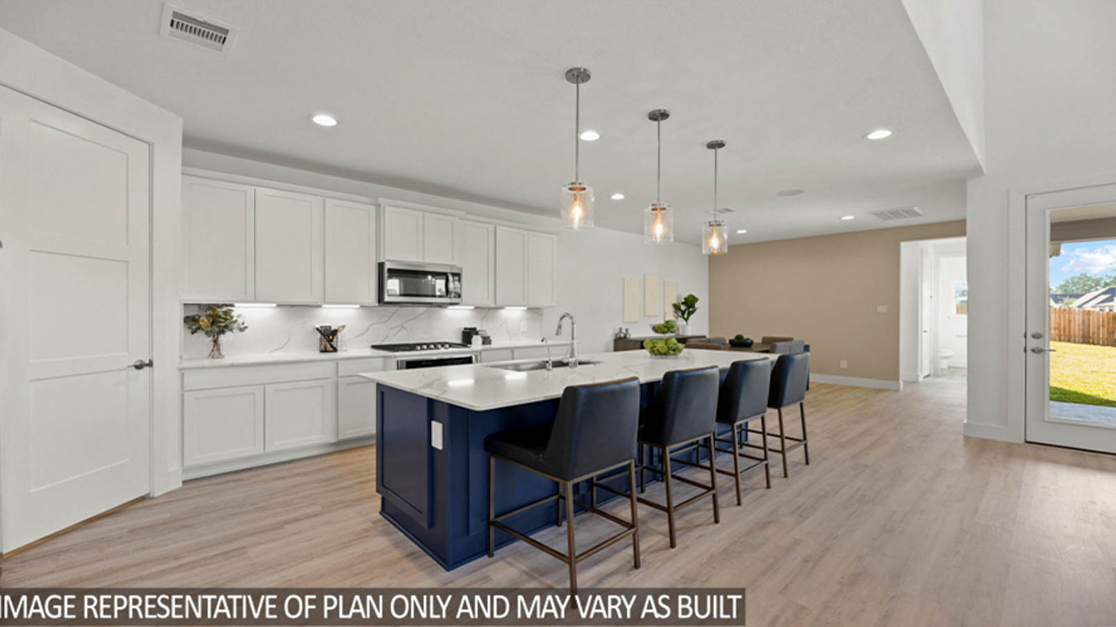 Open concept living and dining area with vinyl flooring and bright windows.