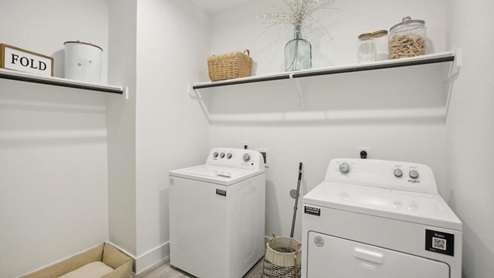 Utility room with overhead storage