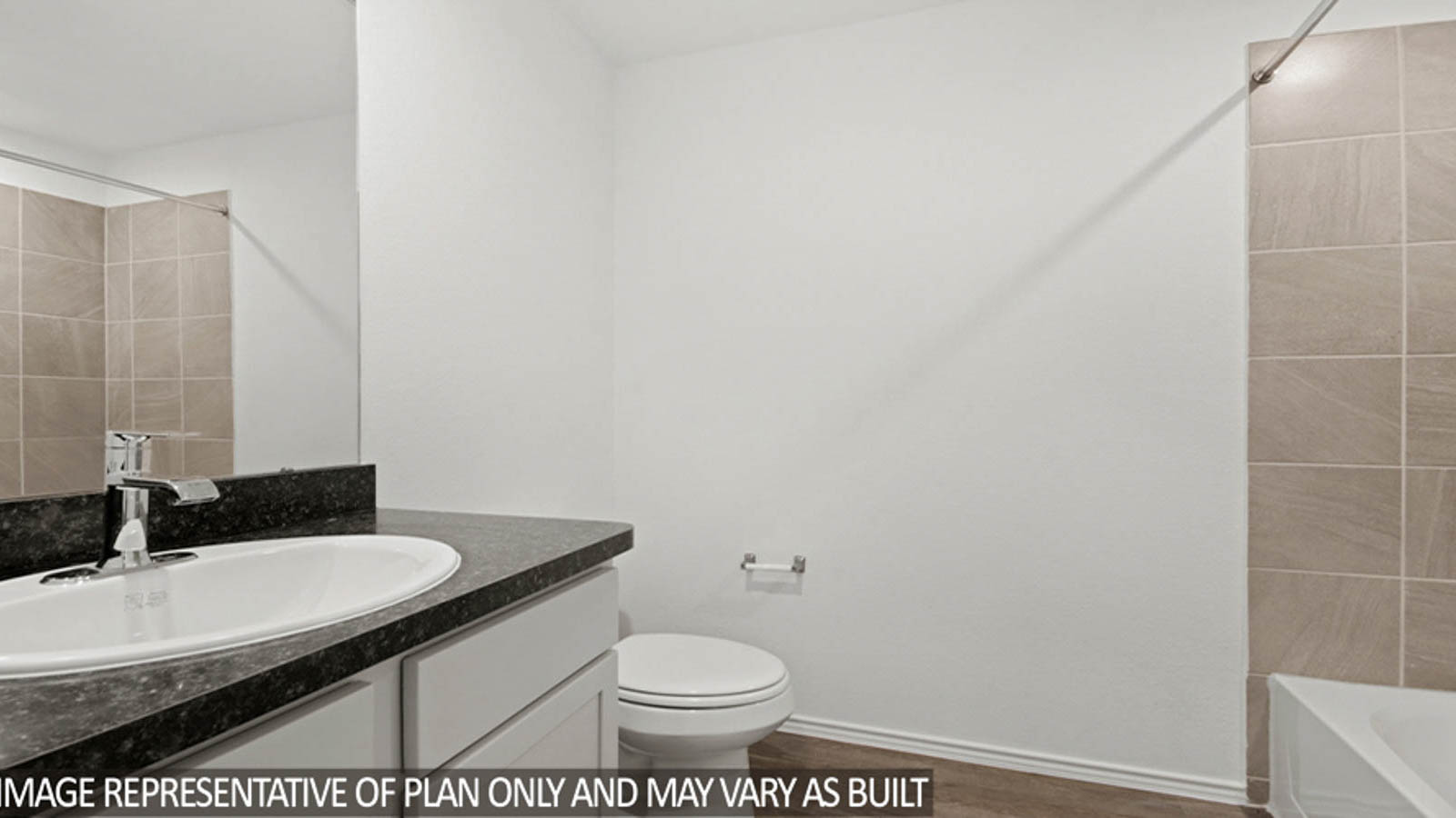 Secondary bathroom with a tile tub/shower combo.