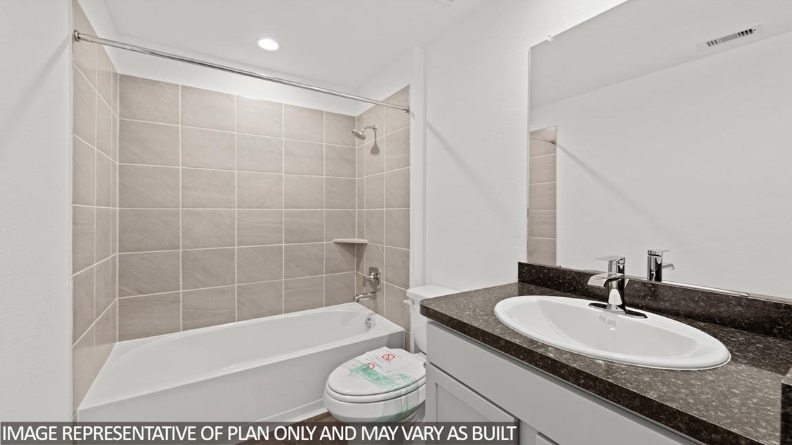 Secondary bathroom with a tile tub/shower combo.