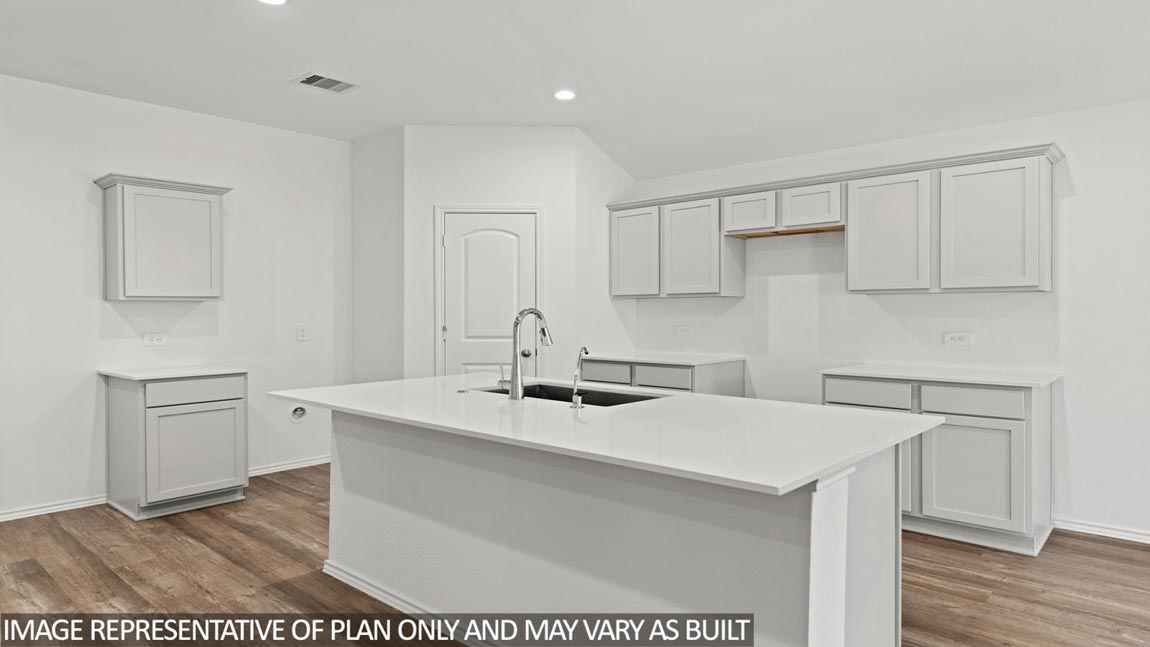 Kitchen with island and large pantry.