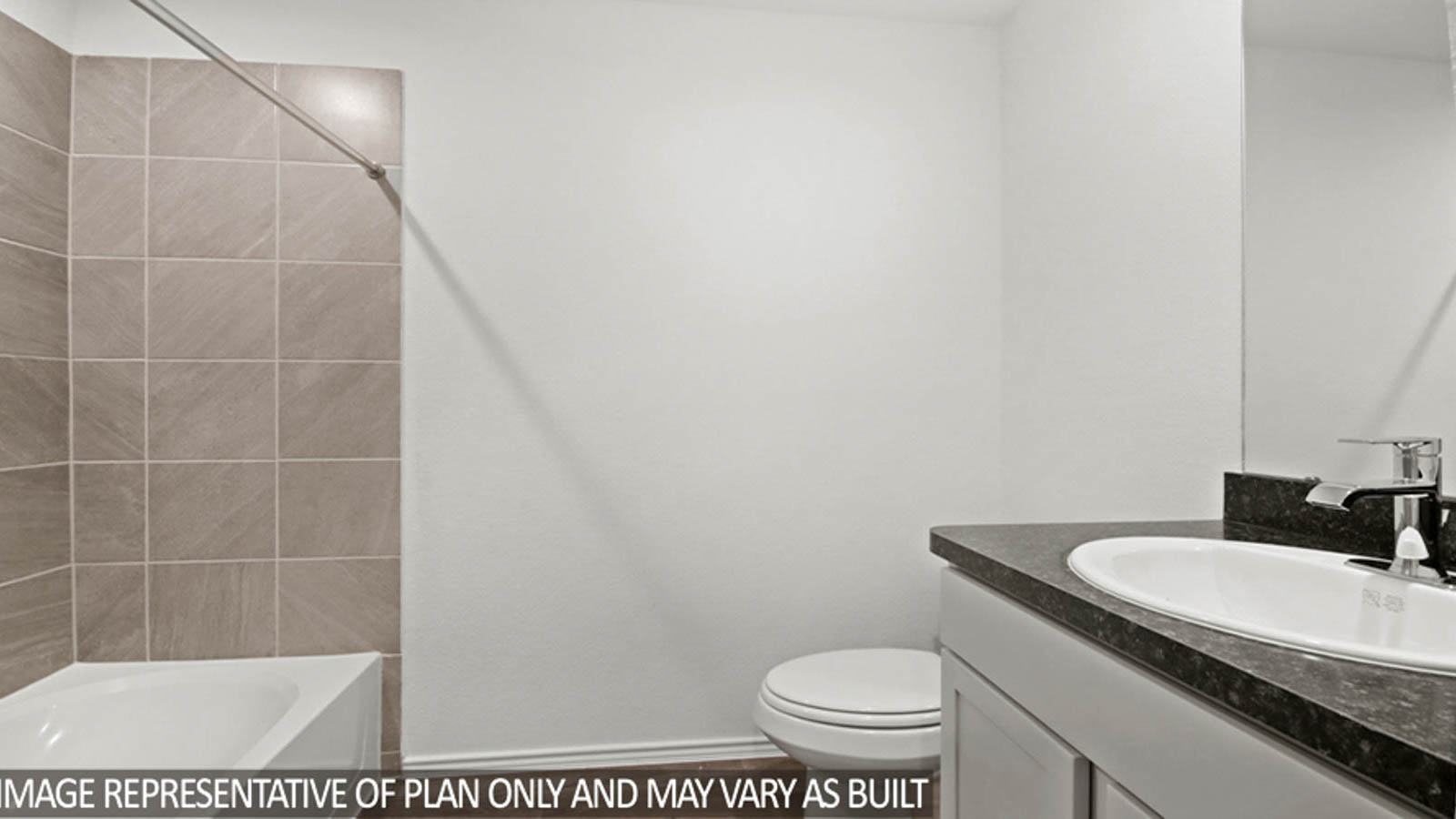 Secondary bathroom with a tile tub/shower combo.