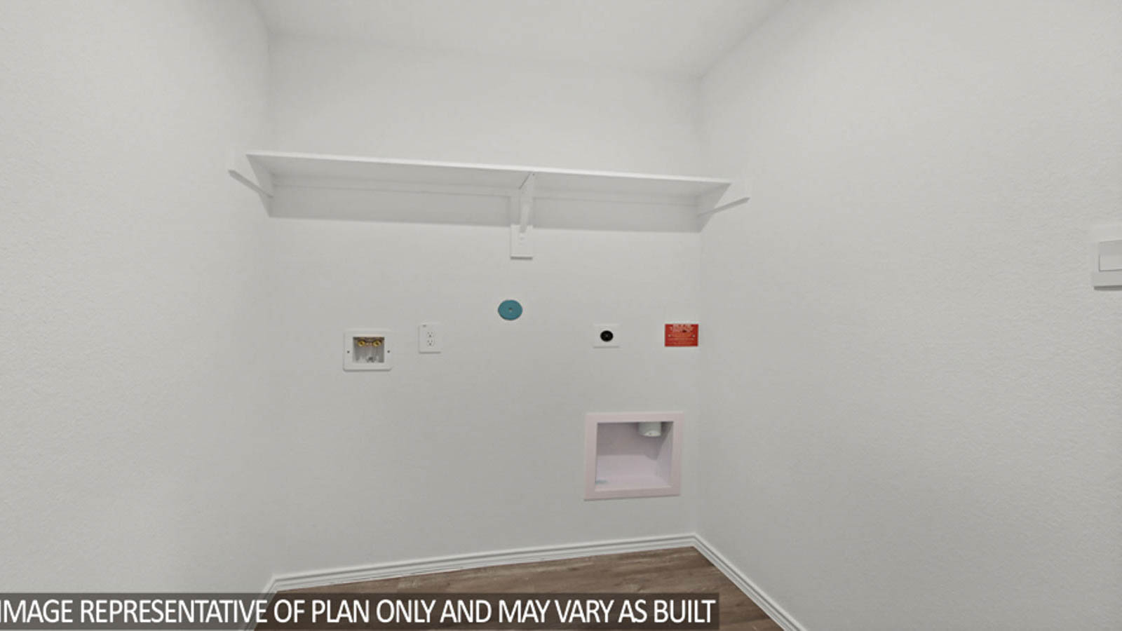 Utility room with vinyl flooring.