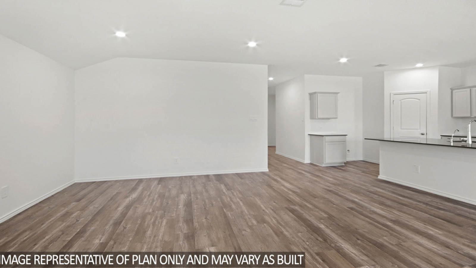 Open concept living and dining area with vinyl flooring and bright windows.