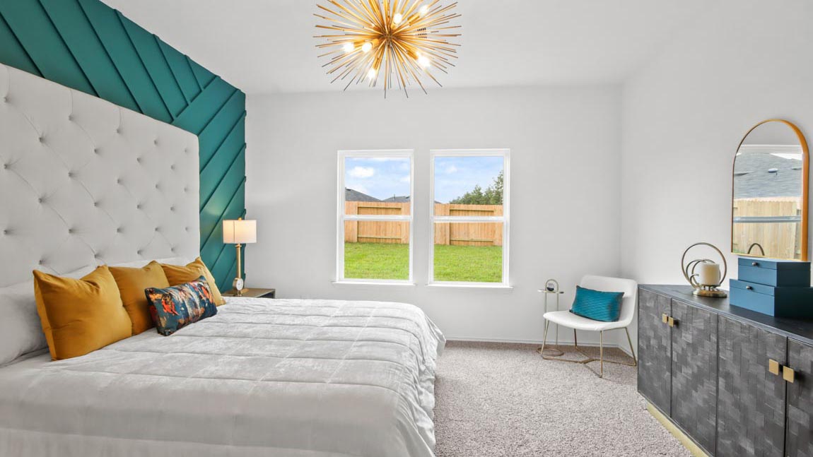 Primary bedroom with carpet flooring