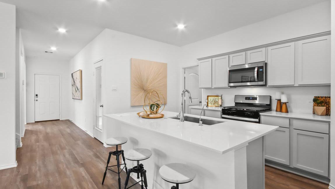 Kitchen with an island and stainless-steel appliances.