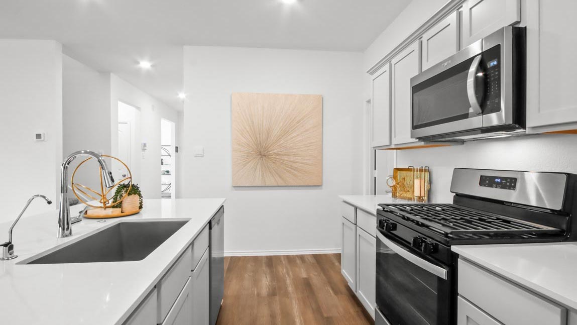 Kitchen with an island and stainless-steel appliances.