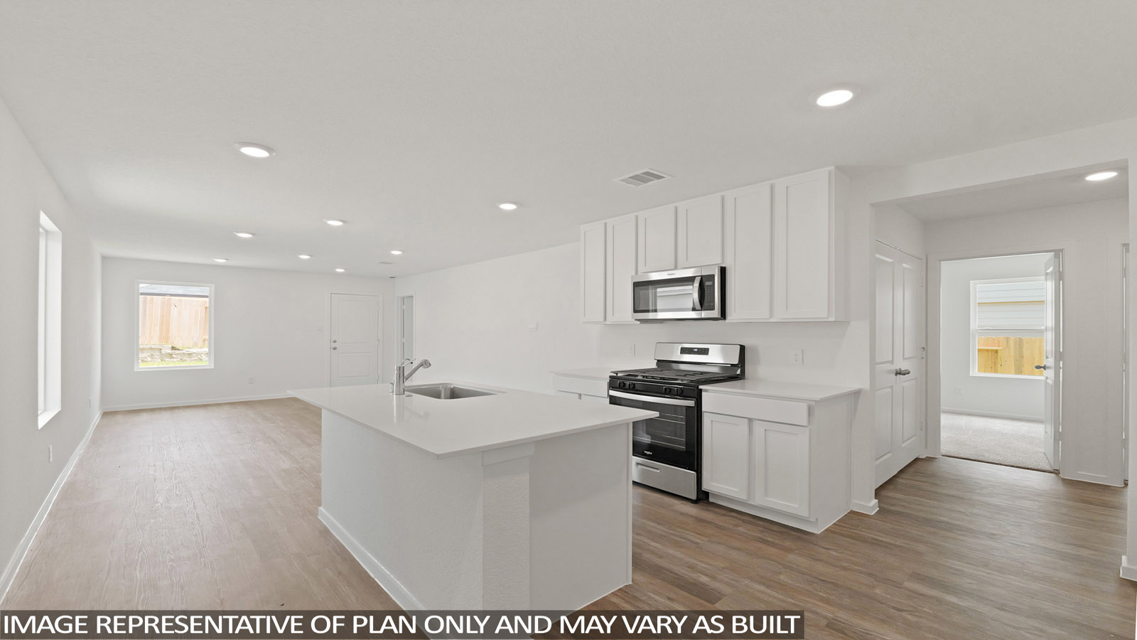 Open concept living, dining, and kitchen area