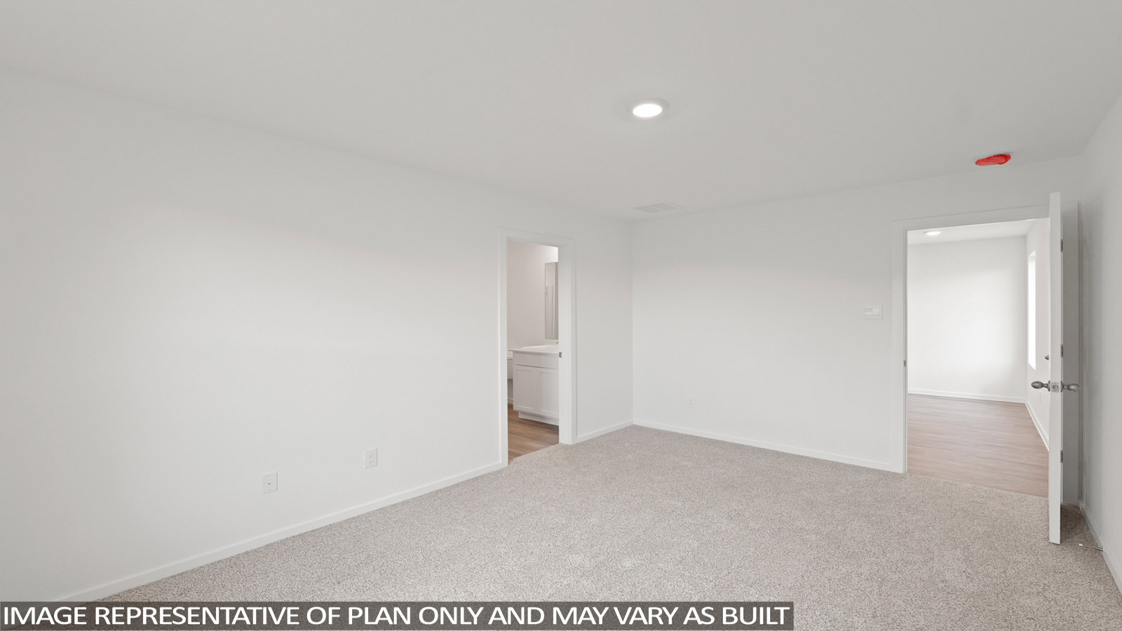 Secondary bedroom with carpet flooring