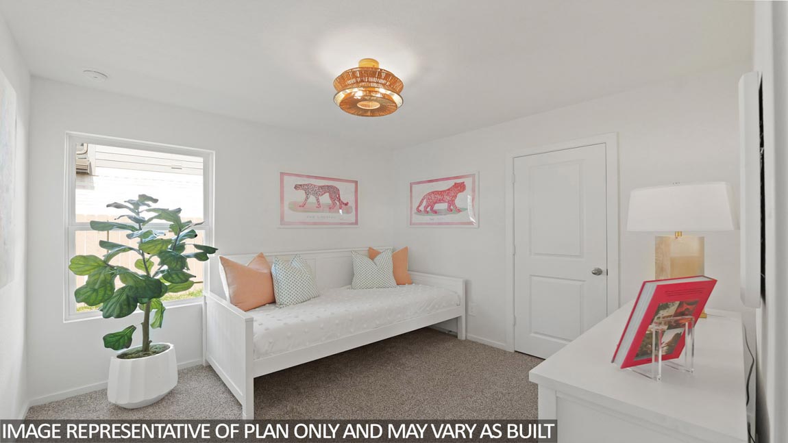 Secondary bedroom with carpet flooring