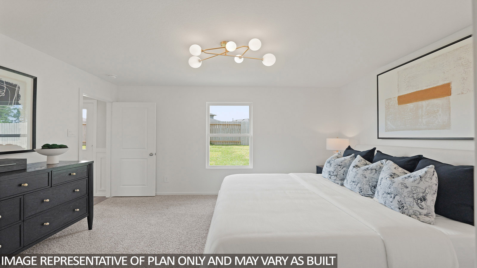 Primary bedroom with carpet flooring