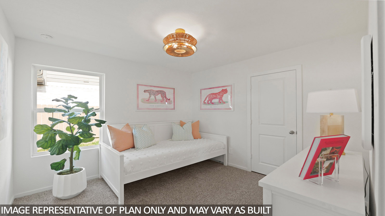 Secondary bedroom with carpet flooring