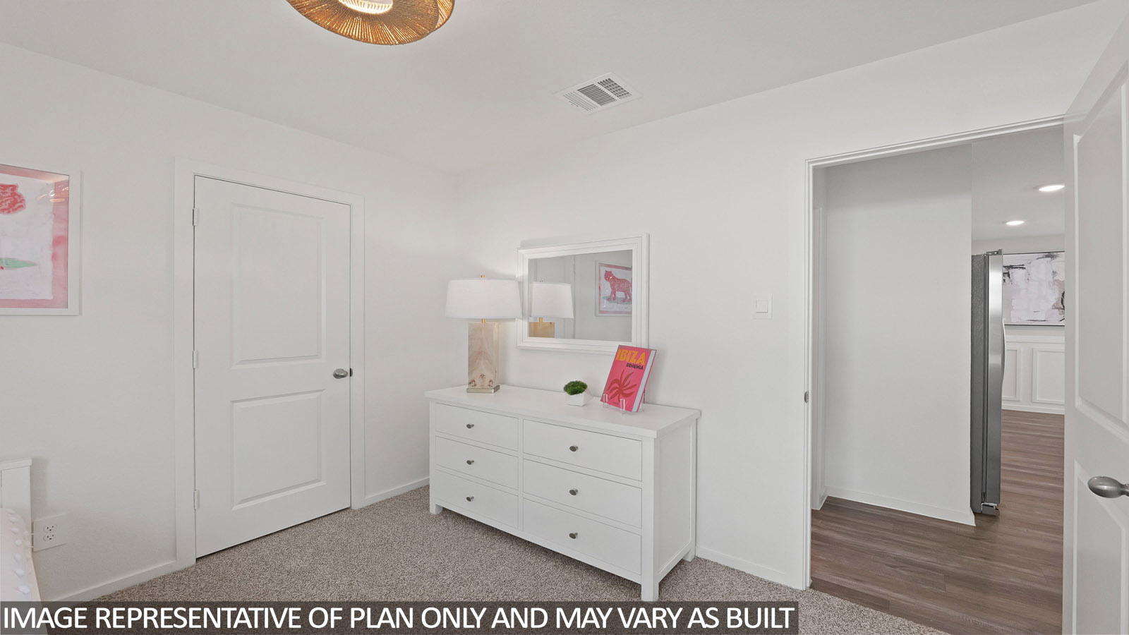 Secondary bedroom with carpet flooring