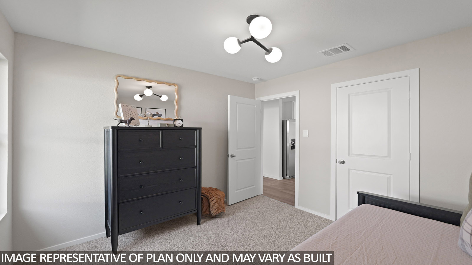 Secondary bedroom with carpet flooring