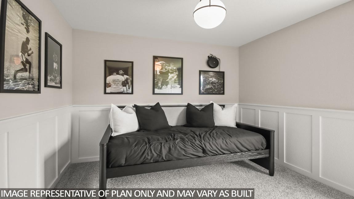 Secondary bedroom with carpet flooring