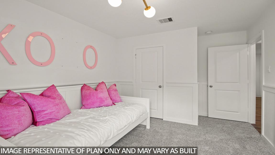 Secondary bedroom with carpet flooring