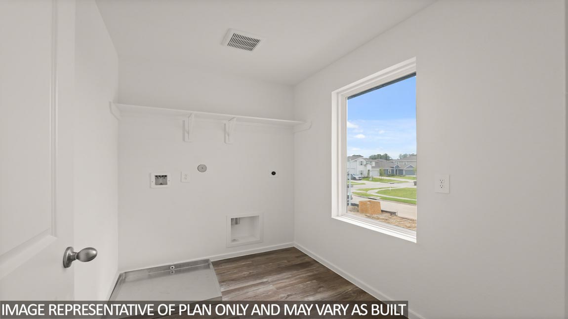 Secondary bedroom with carpet flooring
