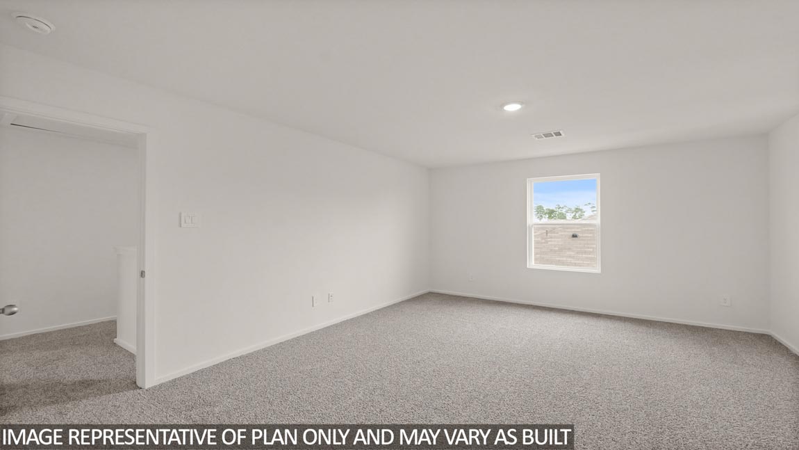 Primary bedroom with carpet flooring