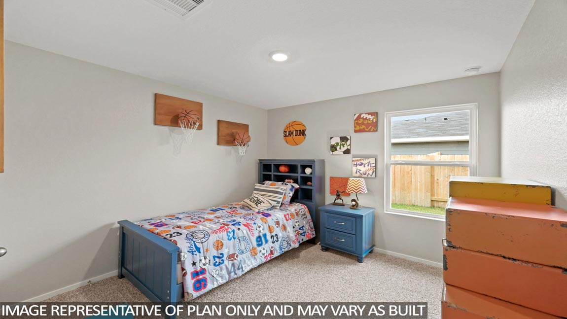 Secondary bedroom with carpet flooring