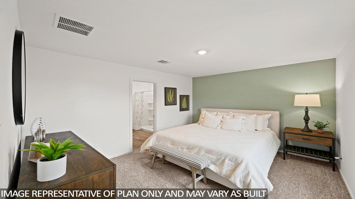 Primary bedroom with carpet flooring