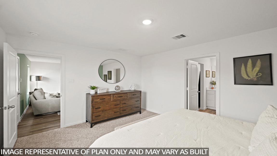 Primary bedroom with carpet flooring
