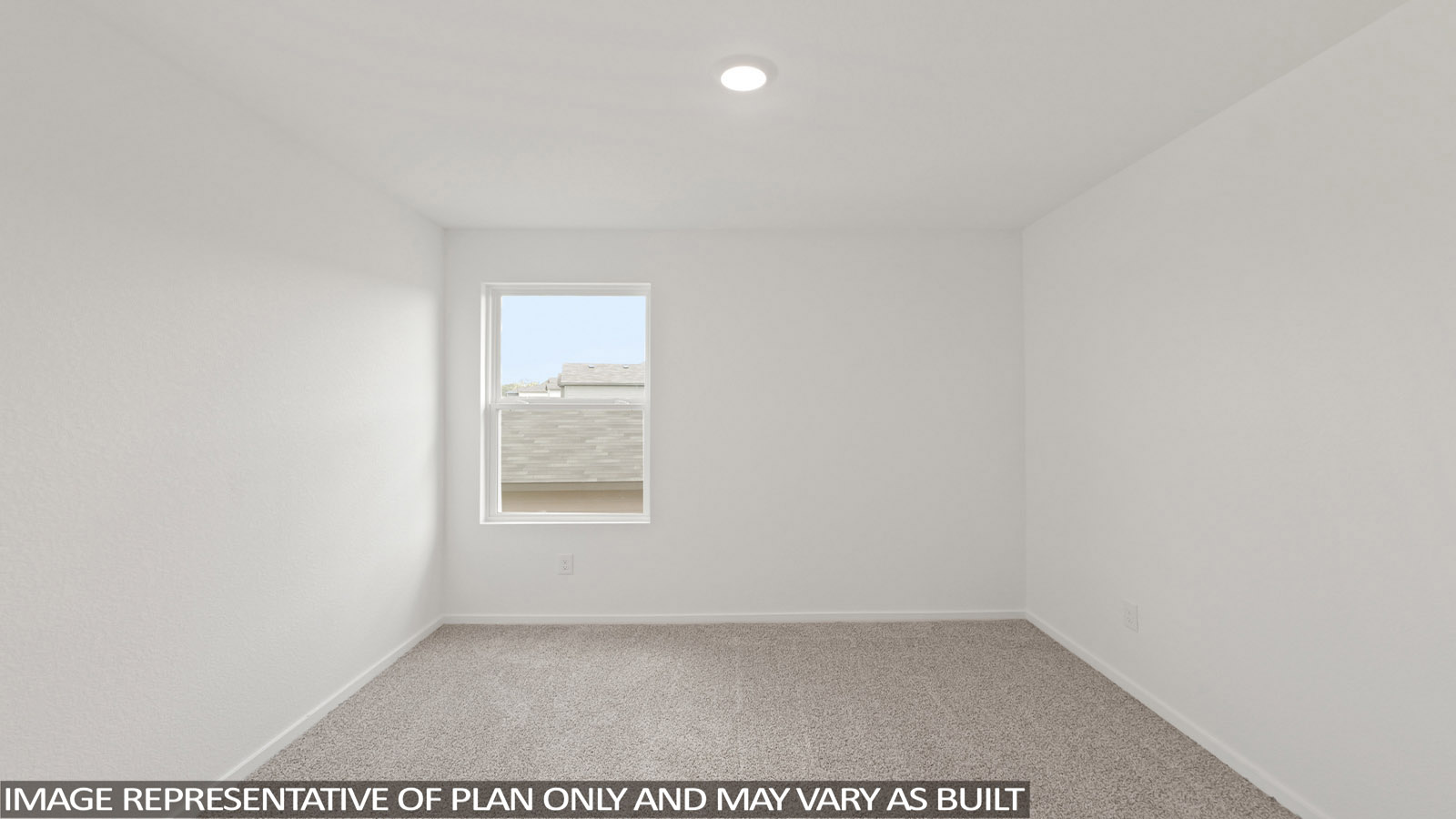 Secondary bedroom with carpet flooring