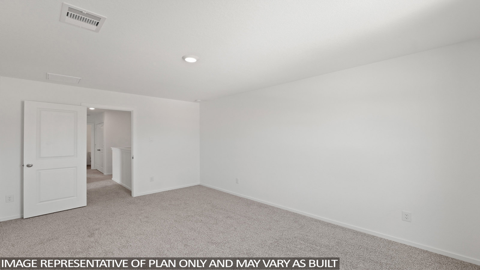 Secondary bedroom with carpet flooring