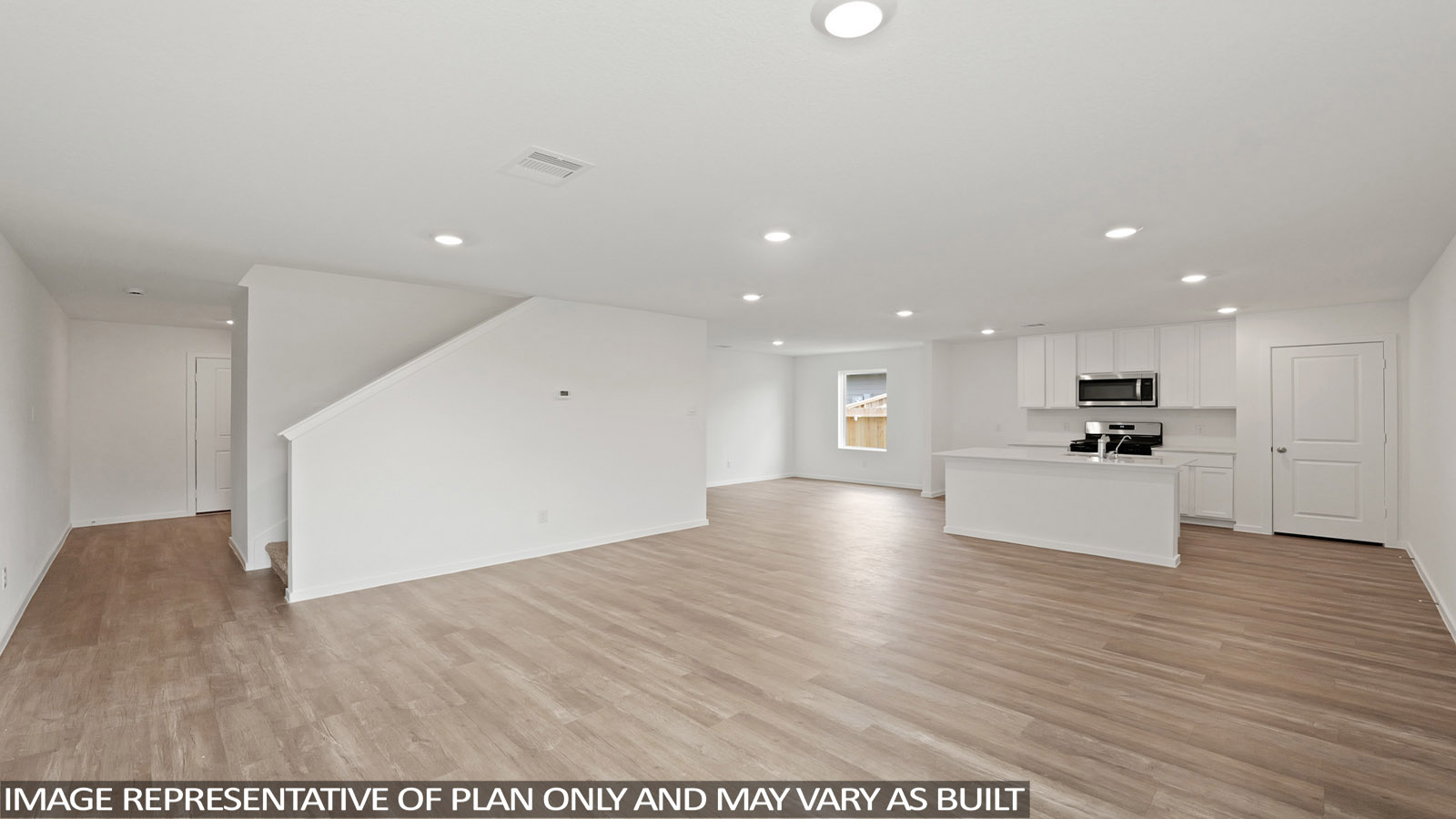Open concept living, dining, and kitchen area
