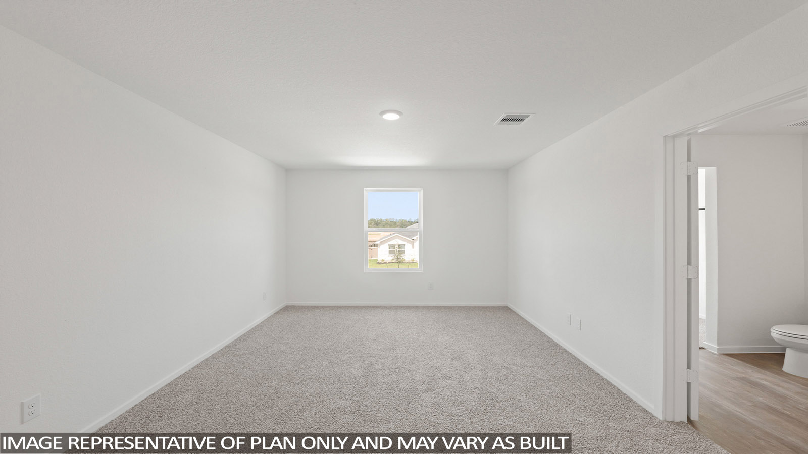 Primary bedroom with carpet flooring