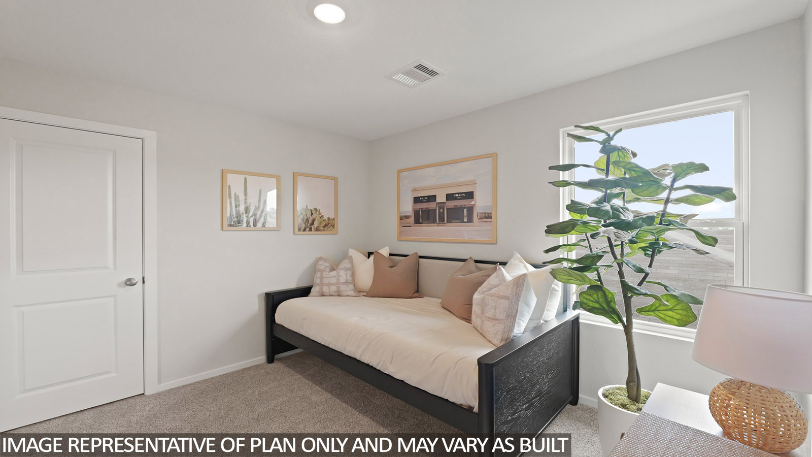 Secondary bedroom with carpet flooring