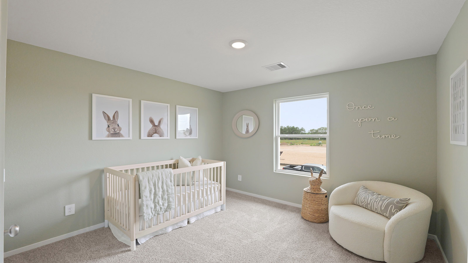 Secondary bedroom with carpet flooring, a bright window, and a tall closet.