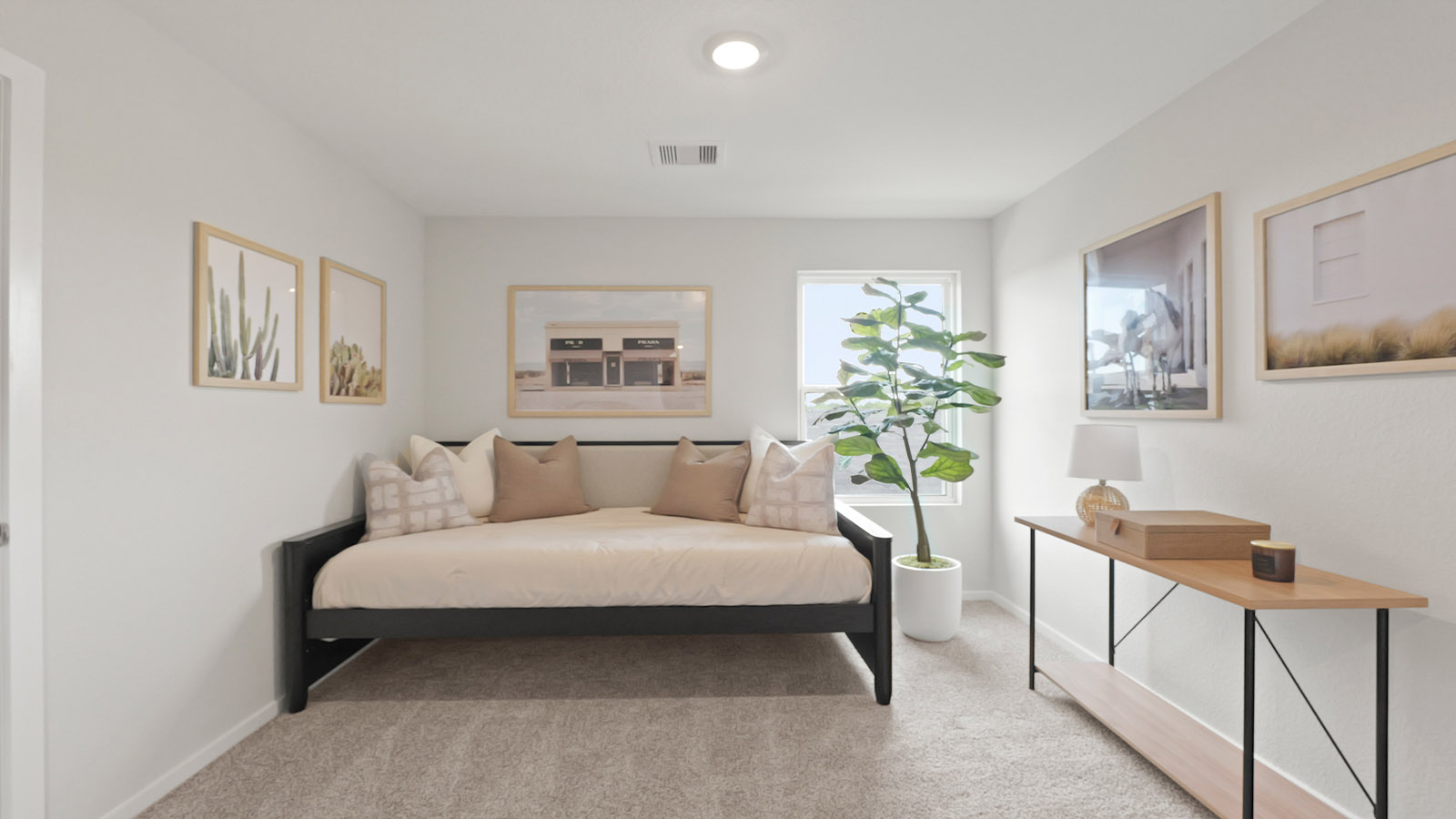 Secondary bedroom with carpet flooring, a bright window, and a tall closet.