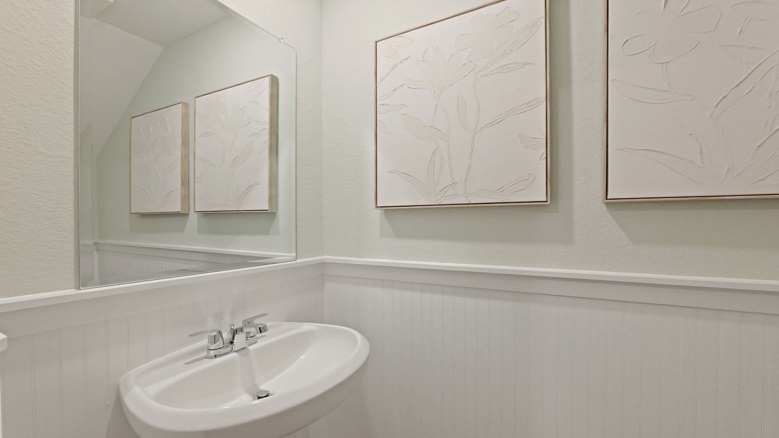 Powder room with a pedestal sink.