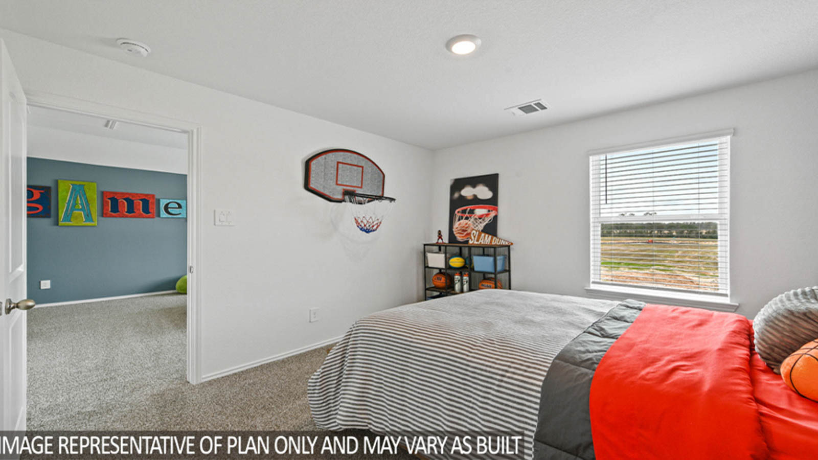 Secondary bedroom with carpet flooring
