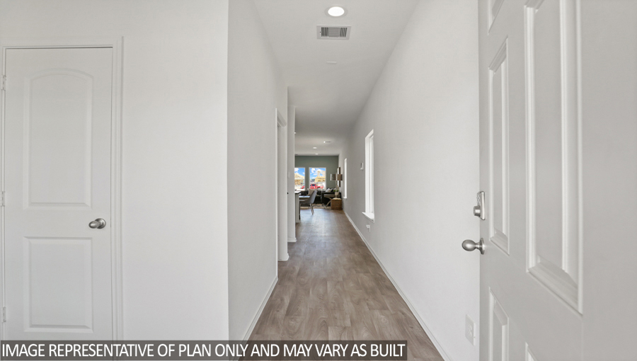 Entryway and foyer with vinyl flooring.