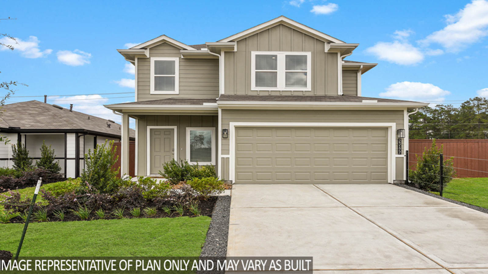 Two-story home with tan details and white trim.