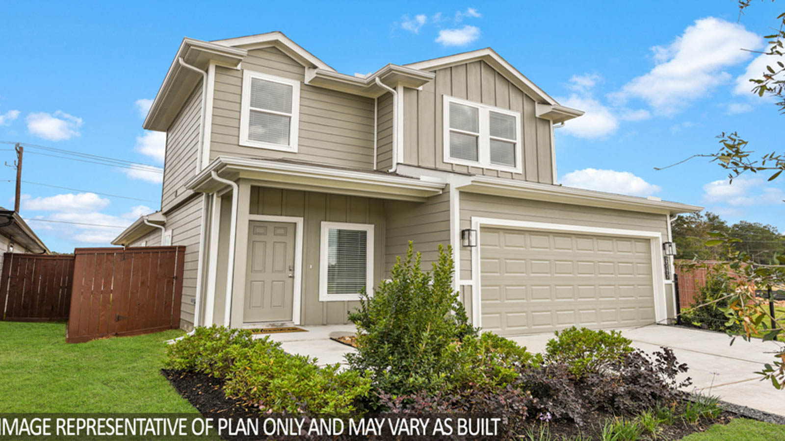 Two-story home with a two-car garage.
