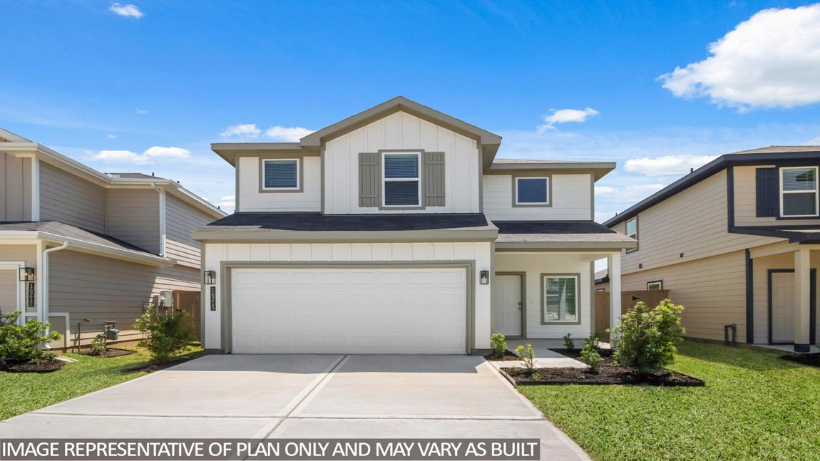 Two-story home with brown hightlights and two-car garage.