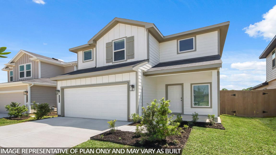 Two-story home with brown hightlights and two-car garage.