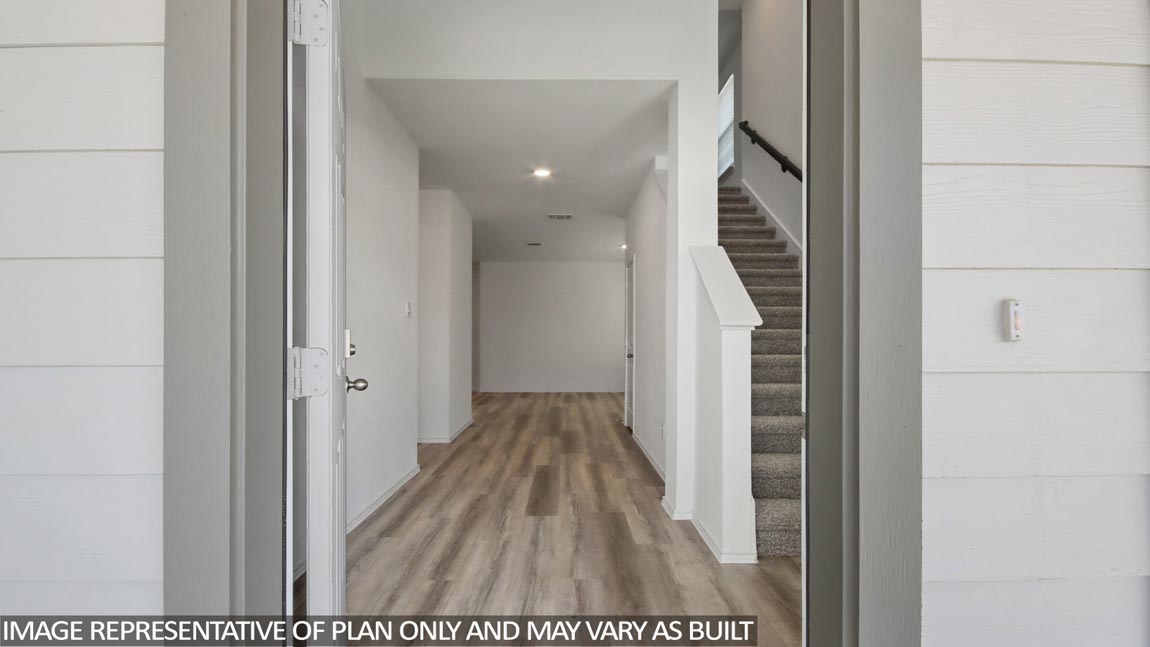 Entryway with vinyl flooring.